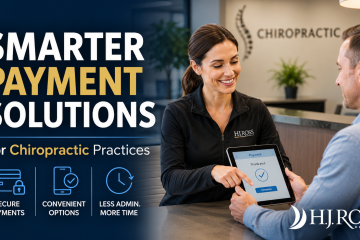 Practice manager helping a chiropractic patient complete a digital payment